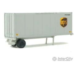 Walthers Scenemaster HO 8601 28' Container With Chassis 2-Pack - Assembled -- United Parcel Service (Modern Shield Logo; Gray, Brown, Yellow) -Walthers Sales walthers scenemaster ho 8601 28 container with chassis 2 pack assembled united parcel service modern shield logo gray brown yellow freight loads containers 479